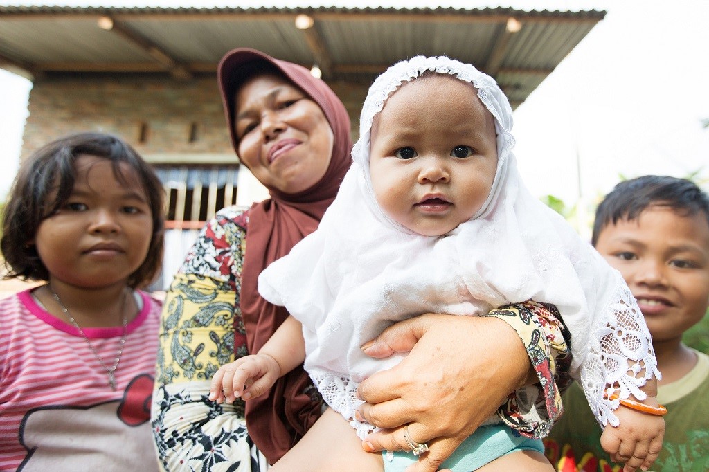 Mother with three children in Indonesia